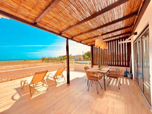 Messini House | Boho Natural Beachfront Detached House