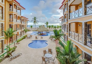 Elegant Condo on Beachfront Property with Shared pool, Ocean Views, and WiFi