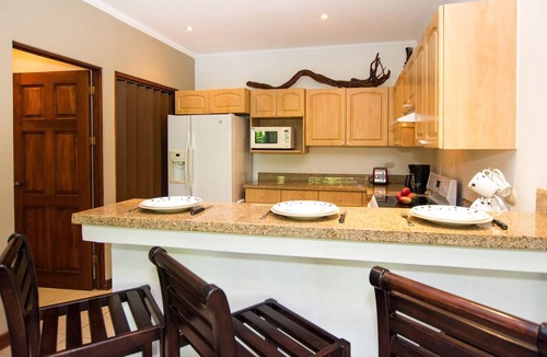 Playa Flamingo Condo | Beautiful Condo in Peaceful Cliffside Location with a Private Balcony & Stunning Ocean and Mountain Views