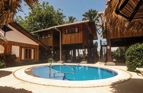 Samara Apartment | Poolside Unit at Beachfront Hotel