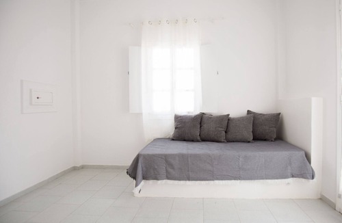 Perissa House | Relaxing environment under trees with a swimming pool, a pool bar.