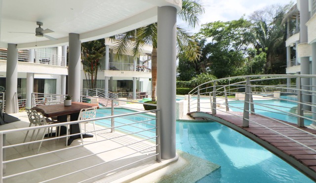 Elegant condo with private pool, AC, lanai with resort pool view - walk to beach